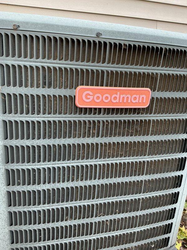 Responded to no cooling complaint on 2011 Amana residential air conditioning system. Upon arrival, performed visual inspection of outdoor condenser unit, which showed normal physical condition with clean coil fins and intact housing. Documented equipment condition with photographs showing Goodman-branded outdoor unit with minor dust accumulation in louvers but no visible damage, blockage, or component failure. Unit required diagnostic troubleshooting to determine root cause of complete cooling loss that began same day.