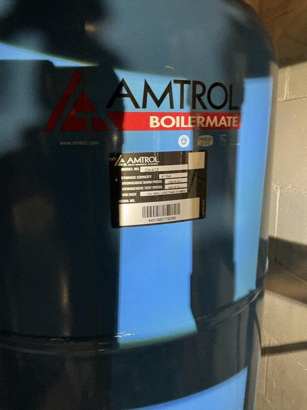 Conducted on-site assessment of existing AMTROL BOILERMATE indirect-fired water heater system experiencing tank leakage. Documented current equipment condition through photography, evaluated hydronic heating system configuration, and provided comprehensive estimate for boiler and hot water tank replacement options to address the active leak condition.