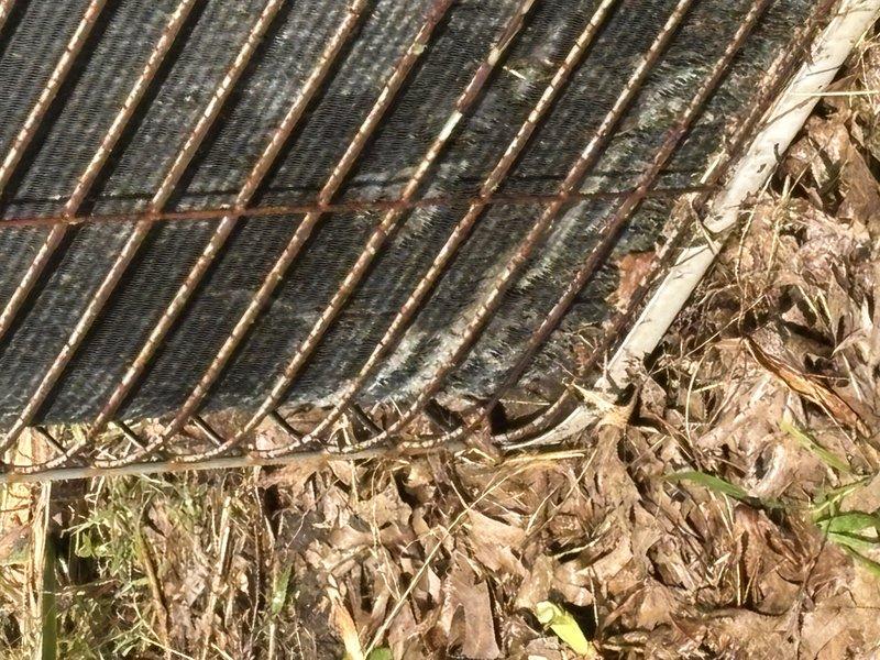 Completed comprehensive super tune-up service on 30-year-old air conditioning system. Removed heavy accumulation of organic debris, dried leaves, grass clippings, and plant material from evaporator coil and condenser unit exterior, restored proper airflow to heat exchanger components, and verified system operational performance.