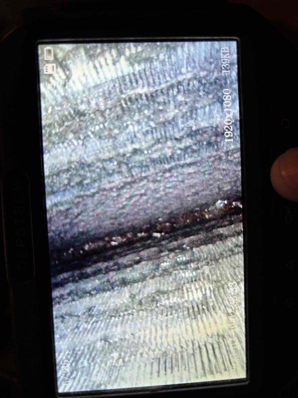 Responded to service call for 25-year-old furnace reported to be short cycling by home buyer's inspector. Performed comprehensive system inspection and diagnostics. Documented heat exchanger condition with photographic evidence showing fin deterioration and age-related wear. Posted official notice tag on equipment detailing findings and recommendations. Unit was producing heat during winter operation but exhibited intermittent cycling issues consistent with aging components and potential safety concerns typical of equipment at end of service life.