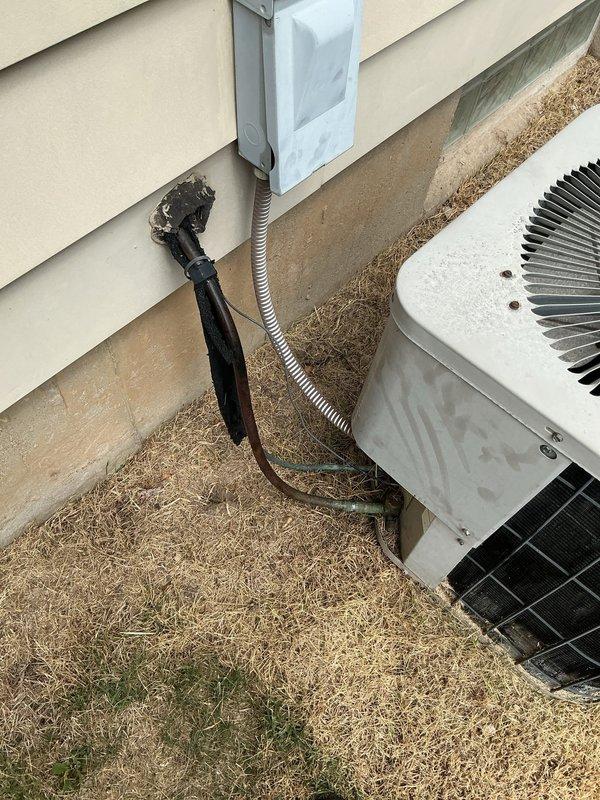 Completed annual cooling maintenance on Goodman air conditioning system. Performed comprehensive inspection of outdoor condenser unit, including examination of cabinet condition, fan motor operation, and electrical connections at disconnect box. Verified proper refrigerant line connections and electrical conduit routing along exterior wall. Inspected unit mounting and pad stability. All components found operating within normal parameters. System tested and confirmed ready for cooling season.