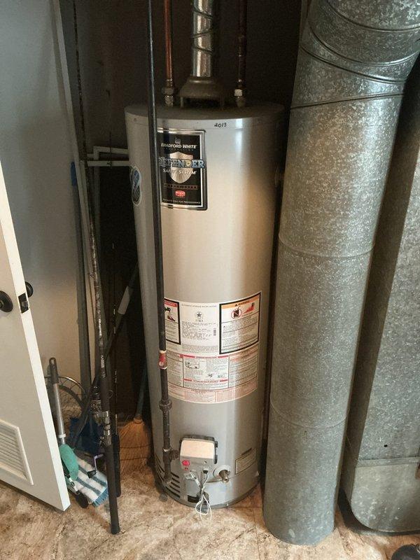 Responded to customer complaint regarding excessive indoor humidity causing mold growth with 14-year-old Carrier HVAC system. Performed diagnostic inspection of furnace and air conditioning equipment in basement mechanical room. Documented existing equipment configuration including Carrier furnace unit, ductwork system, and associated plumbing connections to assess potential causes of humidity control issues such as improper drainage, inadequate dehumidification capacity, or system cycling problems.