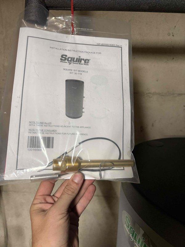 Responded to water leak originating from the temperature control assembly on an 8-year-old Utica WT 11 water heater manufactured in 2027. Diagnosed failed thermocouple/temperature sensor at the aquastat connection point causing water seepage. Replaced defective Squire SIT Model 6 thermocouple assembly with new OEM component, ensuring proper connection to control box and secure mounting at brass valve port. Verified all copper piping connections for integrity, tested system operation, and confirmed leak resolution with no further water discharge from control assembly.