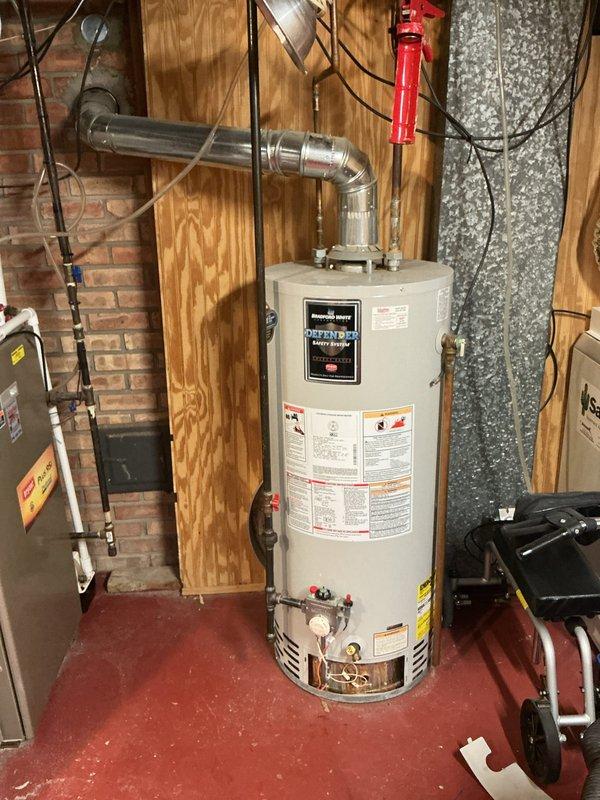 Responded to no hot water condition affecting entire residence. Evaluated existing 21-year-old Bradford White tank-style water heater installed in basement utility area. Unit has exceeded typical service life expectancy and customer requested replacement estimate rather than repair options. Documented current installation configuration including gas supply connections, water piping, venting system through brick wall, and electrical connections. Photographed equipment nameplate data, utility room layout, and existing infrastructure to prepare accurate replacement proposal. No active leaks or immediate safety hazards observed during assessment. Provided comprehensive estimate for new water heater installation.