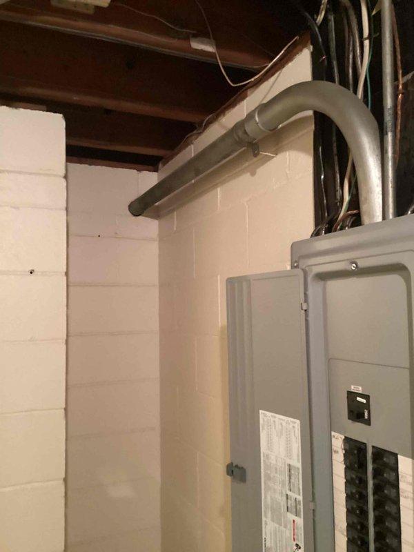 Conducted site evaluation for standby generator installation estimate. Assessed existing electrical infrastructure including main distribution panel, circuit breaker configuration, and available conduit pathways in basement utility area. Documented electrical service capacity, panel location, and mounting surface conditions to determine optimal generator placement and transfer switch integration requirements. Photographed electrical panels and service entrance to support Kohler generator system specifications and installation planning.