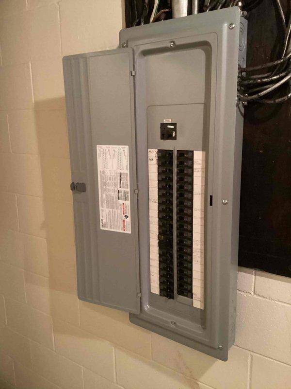 Conducted site evaluation for standby generator installation estimate. Assessed existing electrical infrastructure including main distribution panel, circuit breaker configuration, and available conduit pathways in basement utility area. Documented electrical service capacity, panel location, and mounting surface conditions to determine optimal generator placement and transfer switch integration requirements. Photographed electrical panels and service entrance to support Kohler generator system specifications and installation planning.