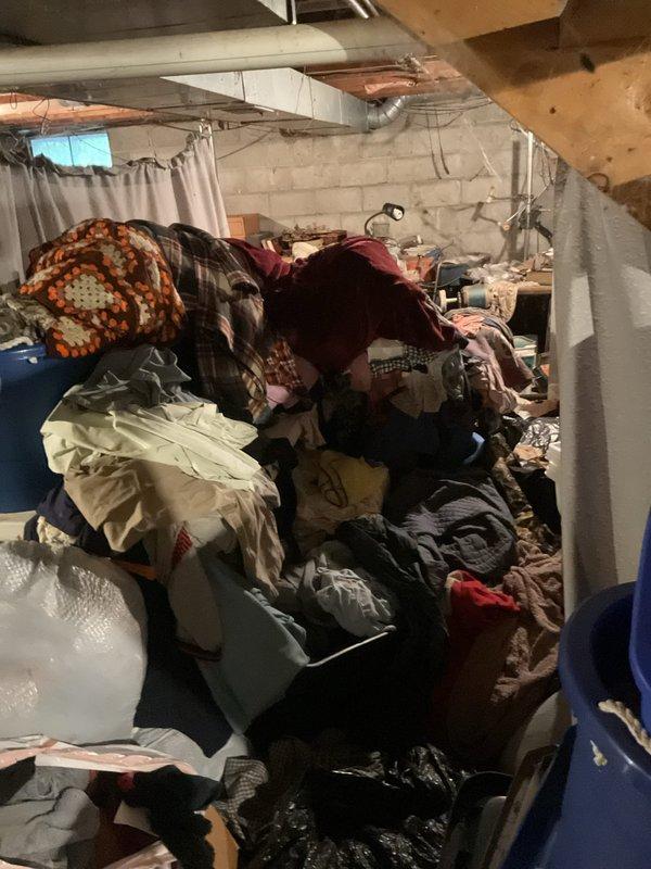 Responded to plumbing leak in basement of 50-year-old single family residence. Upon arrival, found basement utility area with significant clutter and stored items throughout space, making initial access challenging. Inspected exposed copper piping, HVAC ductwork, and concrete block walls for signs of active leakage or water damage. Leak had been present for extended but undetermined period. Conducted thorough visual assessment of plumbing infrastructure, including supply lines and drainage systems visible in basement area. Documented conditions with photographs showing workspace layout, stored materials, and mechanical systems. No additional leaks reported in other areas of home. Completed inspection and provided recommendations for addressing identified plumbing issue.