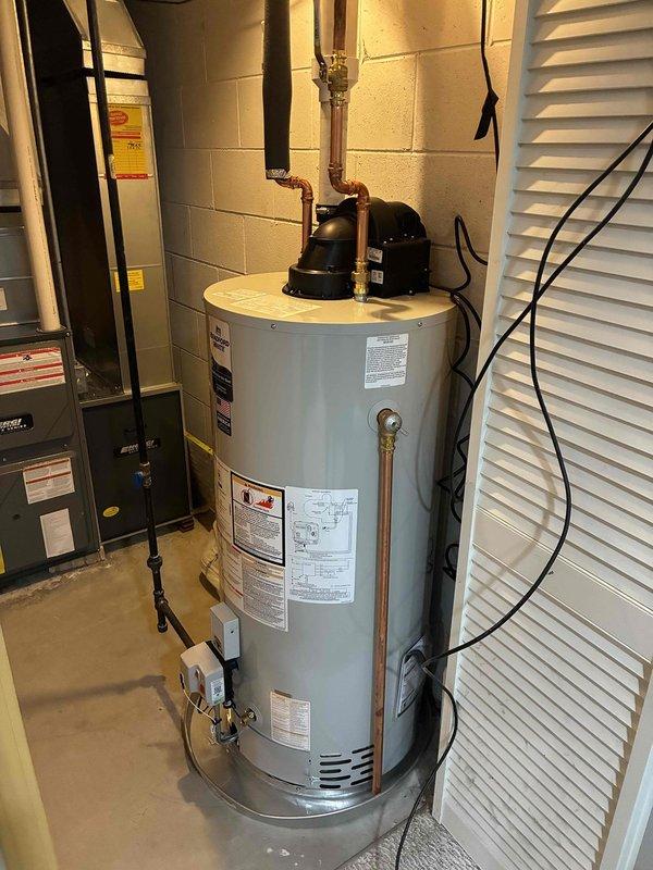 Successfully installed a 50-gallon power vent natural gas water heater in the basement utility room. All copper supply lines were connected to the unit, proper venting was established, and the installation was completed according to manufacturer specifications and local code requirements.