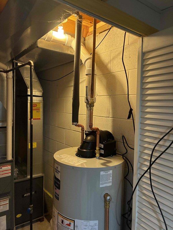 Successfully installed a 50-gallon power vent natural gas water heater in the basement utility room. All copper supply lines were connected to the unit, proper venting was established, and the installation was completed according to manufacturer specifications and local code requirements.