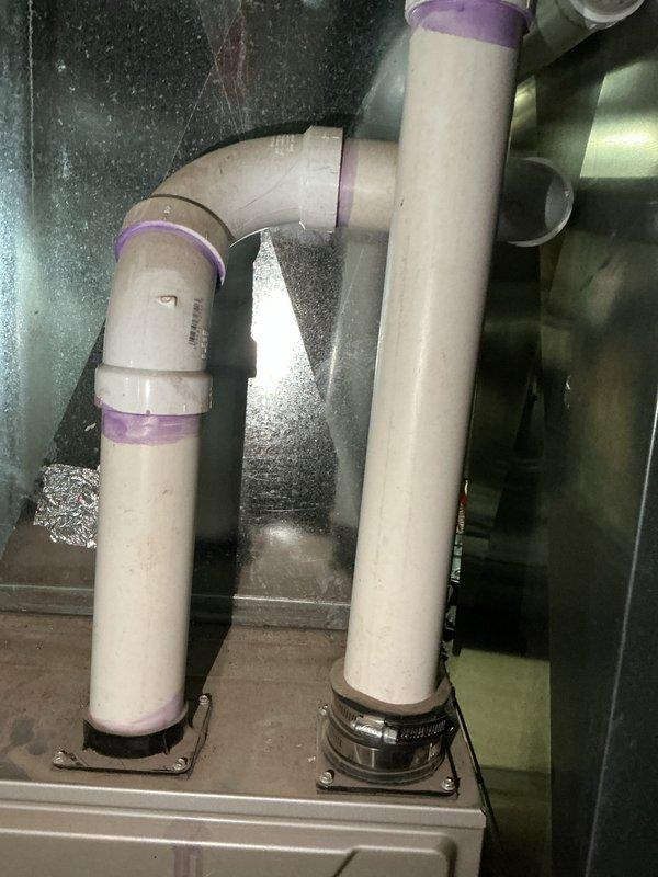 Completed rental inspection of single furnace system with no water heater present. Accessed mechanical equipment through rear basement entry as thermostat was not accessible during visit. Inspected and documented HVAC piping components including PVC supply lines with proper fittings and connections within mechanical cabinet, along with associated ductwork and mounting hardware. Examined basement foundation area including stone masonry construction, floor joists, plumbing drainage lines, and ventilation access points to assess overall system installation and structural conditions.