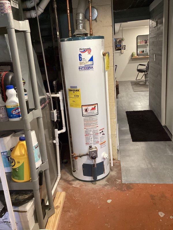 Responded to customer complaint of loud popping, cracking, and rumbling noises occurring during water heater operation. Inspected 7-year-old Richmond Integra water heater installation, documented unit condition, plumbing connections, copper supply lines, brass fittings, expansion tank, and venting system. Provided estimate for water heater replacement to resolve sediment buildup causing thermal expansion noise issues in aging unit.