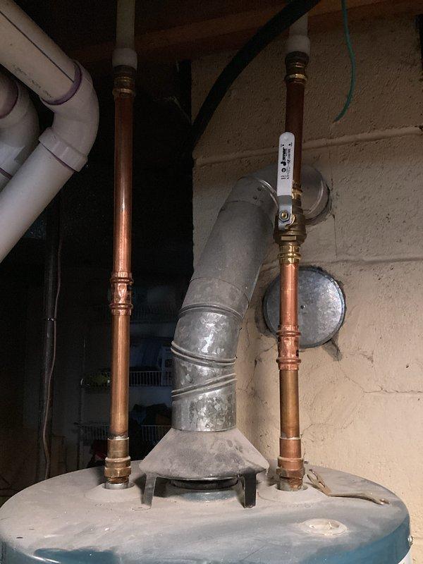 Responded to customer complaint of loud popping, cracking, and rumbling noises occurring during water heater operation. Inspected 7-year-old Richmond Integra water heater installation, documented unit condition, plumbing connections, copper supply lines, brass fittings, expansion tank, and venting system. Provided estimate for water heater replacement to resolve sediment buildup causing thermal expansion noise issues in aging unit.