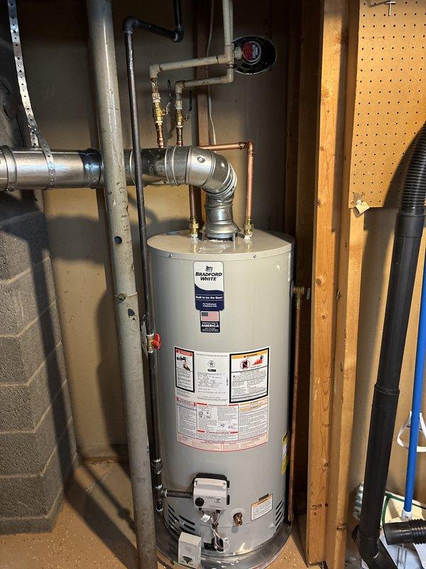 Completed full HVAC system replacement in residential basement utility area. Removed existing equipment and installed new air handler unit and furnace system with proper clearances and mounting. Routed and secured copper refrigerant lines with appropriate brackets, installed metallic supply ductwork with reinforced connections, and connected flexible insulated ducting. Ran electrical conduit and power supply to both units per code requirements. Installed pressure relief valve with PVC discharge piping on water heater. Verified all connections, tested system operation, and confirmed proper airflow through duct system.
