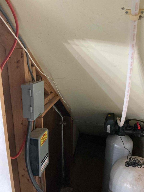 Successfully installed a compact SWS1-30C water softener system and 40-gallon short electric water heater in attic crawl space. Installation included complete electrical connections with dedicated disconnect box, conduit runs, and proper wiring to both units, coordination with electrical contractor for concurrent service, and full plumbing integration with flexible supply lines. Both systems were tested, operational, and covered under 6-year parts and 1-year labor warranty.
