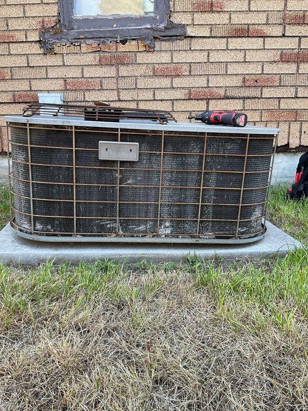 Completed annual cooling maintenance on a 2011 International Comfort Products system. Performed comprehensive tune-up including inspection of outdoor condenser unit, which showed significant dirt and debris accumulation on protective grille. Inspected indoor condensate pump assembly with blue reservoir tank, noting moderate dust buildup but confirming functional operation. Verified best contact number on file and documented system condition with photographs for service records.