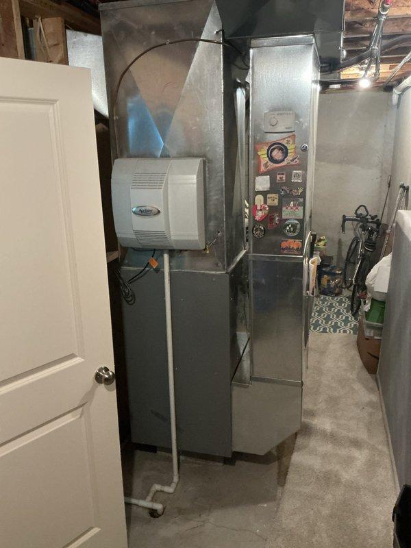 Conducted comprehensive estimate for residential air conditioning system replacement. Documented existing HVAC equipment including basement-mounted furnace with Aprilaire humidifier and associated ductwork, electrical controls, and outdoor condenser unit with refrigerant lines. Assessed current system configuration and provided detailed recommendations for new AC installation to meet customer cooling requirements.