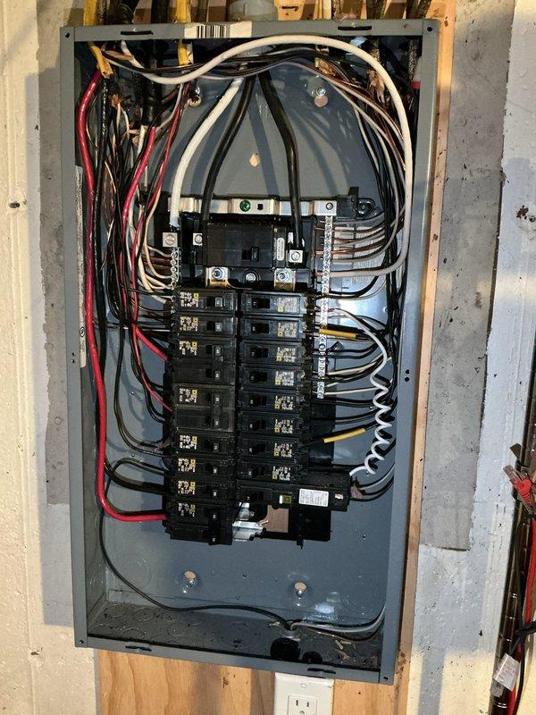 Installed dedicated electrical circuit and panel infrastructure for EV charger installation. Completed rough-in wiring with proper conductor sizing, installed circuit breakers in main service panel, and routed branch circuits through wall framing per code requirements. All connections torqued to manufacturer specifications and grounding system verified for safe operation.