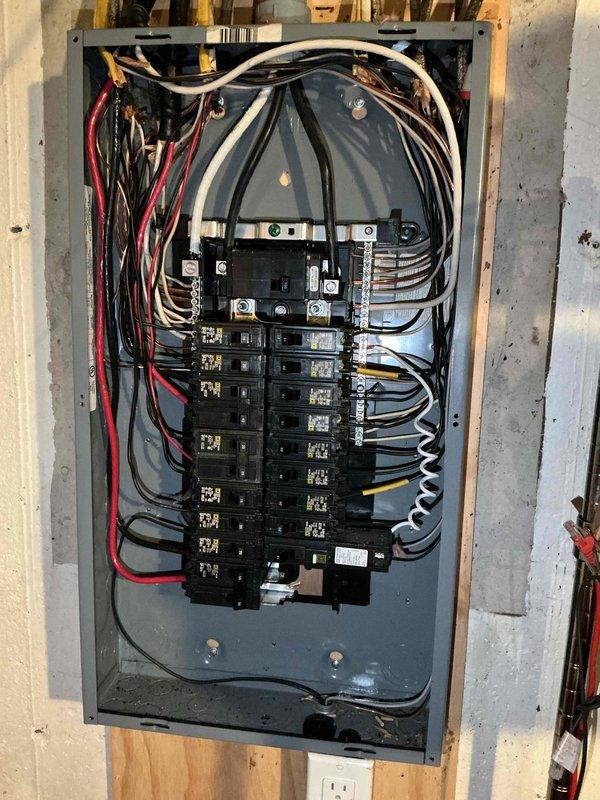 Installed dedicated electrical circuit and panel infrastructure for EV charger installation. Completed rough-in wiring with proper conductor sizing, installed circuit breakers in main service panel, and routed branch circuits through wall framing per code requirements. All connections torqued to manufacturer specifications and grounding system verified for safe operation.
