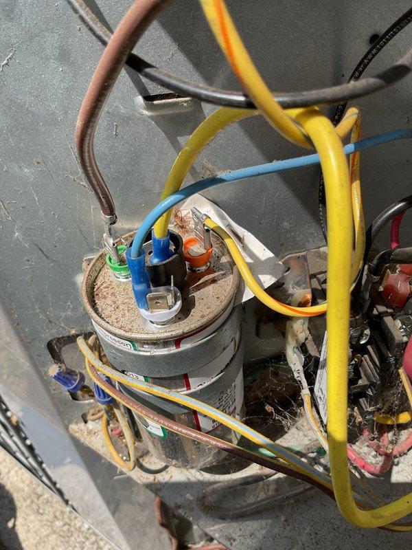 Completed annual cooling maintenance and tune-up on 17-year-old Heil air conditioning system with coil manufactured in 2014. Performed comprehensive inspection of electrical control panel, capacitor, and all associated wiring connections; verified proper operation of contactor and relay components; documented system condition with photos showing typical age-related wear but functional electrical assembly.