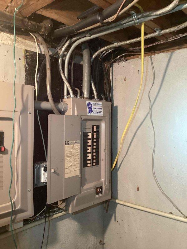 Completed AC tune-up on 16-year-old air conditioning system operating intermittently at time of service call. Performed standard maintenance procedures and system diagnostics, with photographic documentation of electrical panel and associated wiring infrastructure for service records.