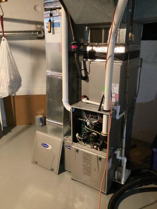 Completed annual cooling maintenance on 9-year-old Carrier HVAC system. Performed comprehensive inspection of furnace, evaporator coil, and air handler components with all access panels opened for thorough evaluation. Verified system airflow specifications against manufacturer's CFM tables for proper air delivery, checked blower motor operation, inspected refrigerant lines and insulation integrity, and examined condensate drainage system. All equipment photographed and documented, system operating within normal parameters with no deficiencies noted at time of service.