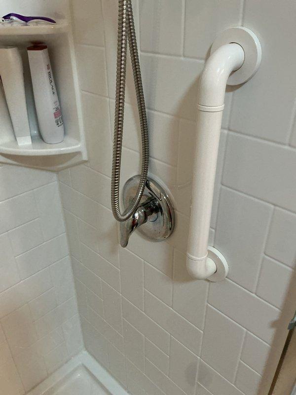 Responded to a slow plumbing leak at a welded pipe connection in the basement storage room that had been active for 2-3 weeks, resulting in approximately 1 inch of standing water accumulation. Inspected the affected area where the customer had placed a pan to catch dripping water, noted water damage to a table in the vicinity, and documented the leak source and surrounding conditions with photographs. No immediate emergency flooding was present at time of service.