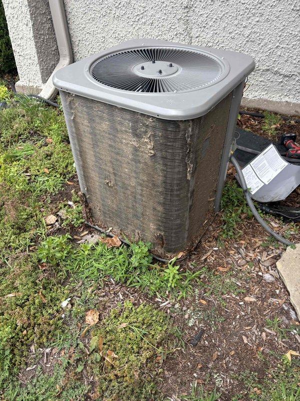 Completed annual cooling maintenance on 10-year-old Lennox air conditioning system. Performed comprehensive tune-up including inspection of outdoor condenser unit, which showed significant dirt and debris accumulation on exterior fins and coil surfaces. Cleaned condenser coils to restore proper airflow and heat transfer efficiency. Verified fan operation and checked electrical connections. System operational upon completion of preventive maintenance service.