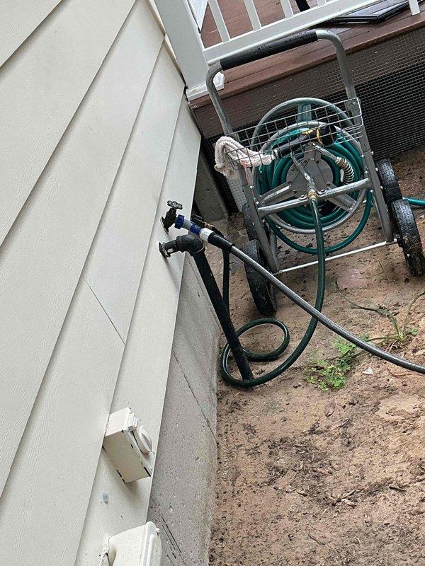Responded to customer report of bathtub fixture failing to shut off completely and dripping garage spigots in 1975-built home. Inspected dual-valve exterior spigot fixture mounted on garage exterior and accessed plumbing system beneath floor joists to evaluate shut-off valves and supply lines. Repaired or replaced worn valve components to restore proper water shut-off function at bathtub fixture and eliminate dripping at garage spigots, returning both fixtures to normal operation.