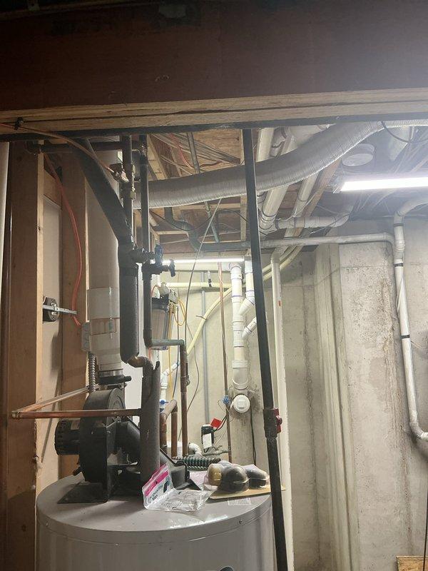 Responded to customer request for estimate regarding exhaust vent clearance near deck area. Conducted site inspection of basement mechanical room containing water heater, furnace, and associated venting systems. Photographed existing installation including exhaust vent routing, ductwork configuration, and clearances to combustible materials. Assessed current exhaust termination location in relation to deck structure to determine code compliance and necessary modifications. Provided customer with recommendations for proper clearance requirements and estimate for any required vent relocation or extension work.