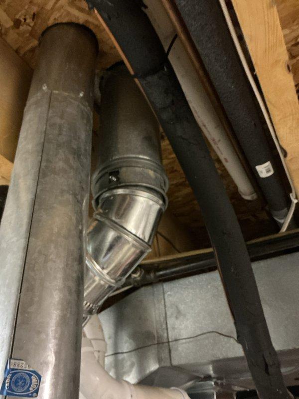 Completed water heater estimate for existing Rheem Fury gas water heater with Guardian System and EverKleen self-cleaning technology, manufactured May 2009. Documented current installation including copper piping connections, brass fittings, and HVAC ductwork configuration in basement area to provide replacement recommendations.