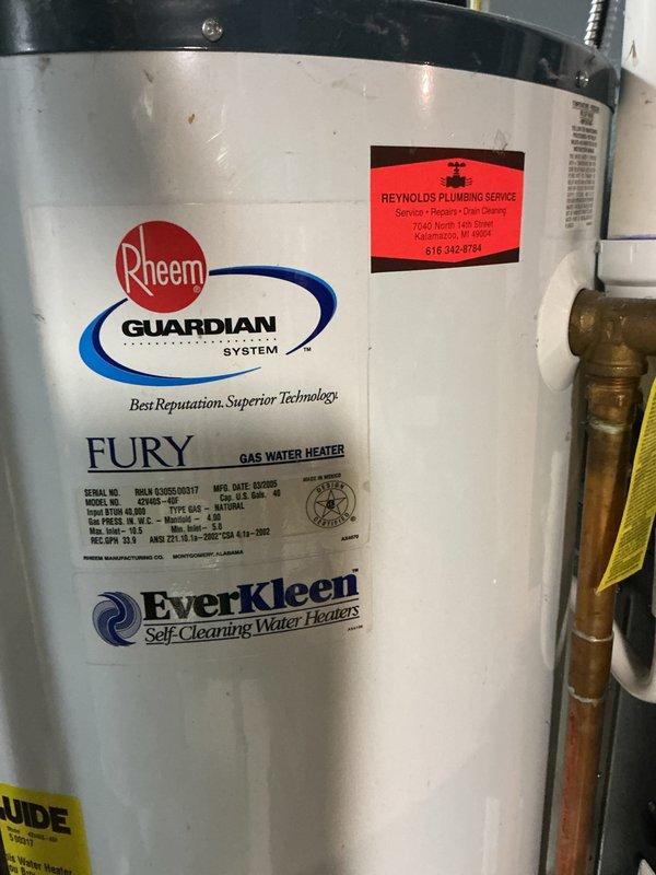 Completed water heater estimate for existing Rheem Fury gas water heater with Guardian System and EverKleen self-cleaning technology, manufactured May 2009. Documented current installation including copper piping connections, brass fittings, and HVAC ductwork configuration in basement area to provide replacement recommendations.