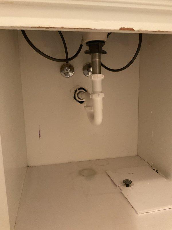 Completed faucet replacement using company-supplied fixture. Disconnected existing water supply lines, removed old faucet assembly, and installed new faucet with proper mounting and sealing. Reconnected hot and cold water supply lines with flexible hoses to shut-off valves, verified all connections for leaks, and tested faucet operation to ensure proper water flow and drainage through existing P-trap assembly.