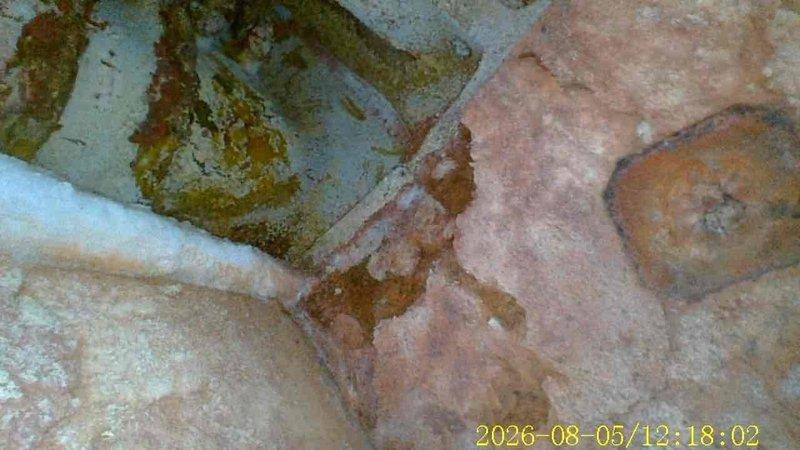 Responded to no heat call at single family residence. Upon arrival, located furnace and performed diagnostic inspection. Discovered significant moisture damage and deterioration to building materials and insulation surrounding furnace area. Evidence of long-term water intrusion with visible rust-colored staining, mold growth, and material degradation throughout insulation and adjacent surfaces. Documented extensive damage with photographs showing compromised insulation integrity and structural concerns. Advised customer of moisture damage findings and potential safety hazards related to furnace operation in current environment. Recommended immediate remediation of water intrusion source and replacement of damaged insulation materials before furnace can be safely serviced or repaired.