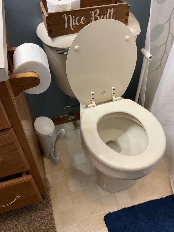 Responded to report of brown/tan water discoloration on basement ceiling below bathroom in 1996-built home, with issue progressively worsening over 4-year period since 2016. Conducted visual inspection of bathroom above affected area, examining toilet, flooring, and surrounding fixtures for signs of active leakage or moisture intrusion. Documented bathroom conditions and basement ceiling staining with photographs showing water damage patterns on textured ceiling and wall surfaces. No active leak observed during inspection; staining indicates historical water intrusion requiring further investigation to determine source, which may include toilet seal failure, supply line issues, or drain pipe concerns.