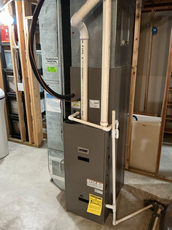 Completed complimentary annual cooling system inspection on 21-year-old Goodman AC unit with Luxaire furnace installed in 2023. Performed comprehensive system evaluation including exterior condensing unit assessment, verified refrigerant levels, inspected electrical connections, cleaned condenser coils, checked airflow at indoor air handler, and documented equipment condition with photos. All components operating within normal parameters; recommended monitoring vegetation growth around outdoor unit to maintain proper clearance for optimal airflow and efficiency.