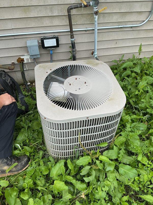 Completed complimentary annual cooling system inspection on 21-year-old Goodman AC unit with Luxaire furnace installed in 2023. Performed comprehensive system evaluation including exterior condensing unit assessment, verified refrigerant levels, inspected electrical connections, cleaned condenser coils, checked airflow at indoor air handler, and documented equipment condition with photos. All components operating within normal parameters; recommended monitoring vegetation growth around outdoor unit to maintain proper clearance for optimal airflow and efficiency.