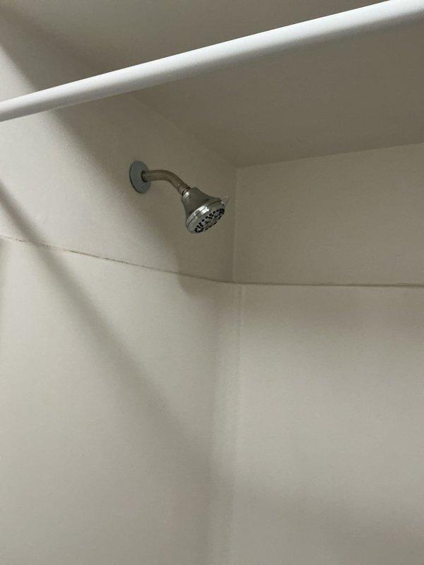 Returned to property to replace defective shower valve that was preventing hot water delivery to the shower fixture. Removed existing valve assembly, installed new chrome shower valve with single-handle temperature control, tested water flow and temperature mixing function to verify proper hot water delivery. System now operating correctly with full hot and cold water control restored.