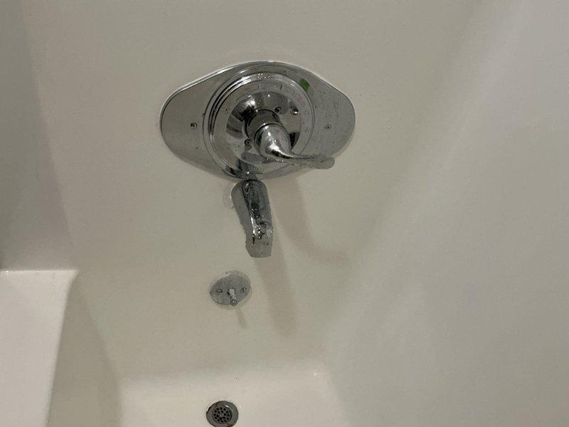 Returned to property to replace defective shower valve that was preventing hot water delivery to the shower fixture. Removed existing valve assembly, installed new chrome shower valve with single-handle temperature control, tested water flow and temperature mixing function to verify proper hot water delivery. System now operating correctly with full hot and cold water control restored.