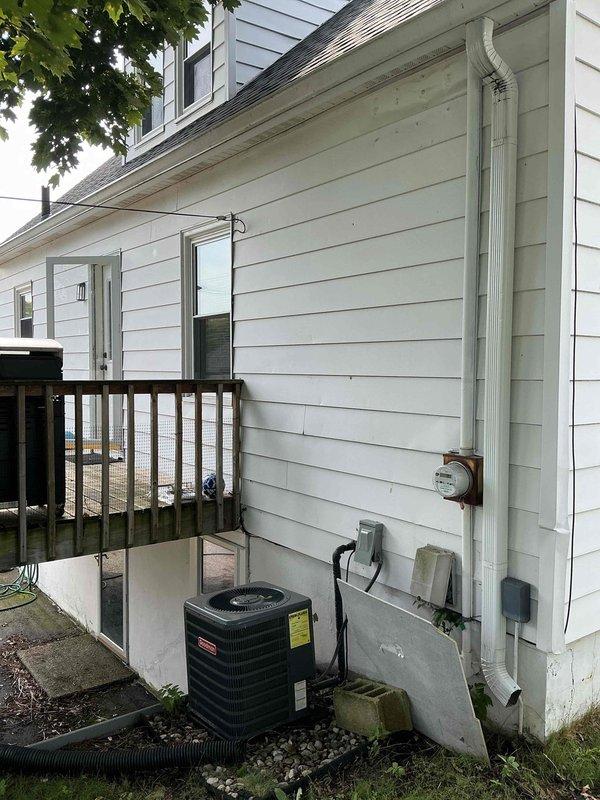 Conducted electrical estimate for 240V hot tub installation at residential property. Assessed existing electrical infrastructure including main panel location in interior wall cavity and available exterior access points near HVAC equipment and deck area. Documented current electrical service capacity, panel configuration with existing circuit breakers, and optimal routing path for new dedicated 240V circuit from panel to proposed hot tub location on deck.