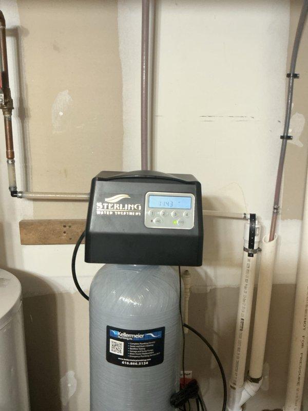 Responded to service call for Sterling Water Treatment water softener system leaking from display panel. Upon inspection, identified water intrusion at control head assembly causing moisture damage to internal electrical components and display unit. Removed control head cover to access wiring connections and microswitch assembly. Found compromised seal allowing water to migrate into electronic control module. Cleaned and dried affected electrical connections, replaced damaged quick-connect terminals, and resealed control head housing to prevent future water intrusion. Tested system operation through multiple regeneration cycles to verify proper function of control board, display panel, and all electrical components. System restored to normal operation with no active leaks detected at control head or display panel area.