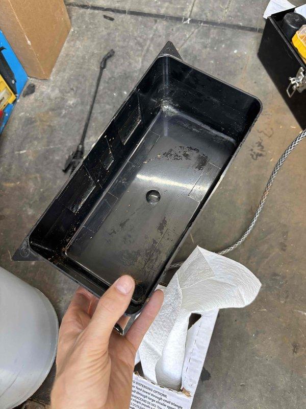 Completed annual cooling maintenance on 30-year-old air conditioning system with customer reporting inadequate cooling to upstairs areas. Upon inspection, discovered outdoor disconnect box in severely deteriorated condition with extensive corrosion on contactor assembly and terminal connections. Electrical components showed heavy rust and oxidation throughout. Found significant accumulation of organic debris, decomposed leaves, dirt, and biological material within disconnect enclosure that posed safety and operational concerns. Cleaned and serviced condensate drain pan, which exhibited dirt and grime buildup from extended use. Addressed electrical safety issues related to corroded connections and contaminated enclosure. System evaluated for cooling performance deficiencies affecting upper level distribution.