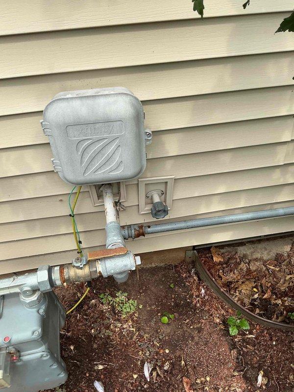 Responded to service call for well pump cycling issue where pressure system was turning on and off excessively. Inspected Water Worker pressure tank and associated plumbing components in basement utility area. Evaluated pressure switch, tank air charge, and system operation following recent emergency repairs performed by another contractor. Documented existing conditions including pressure tank, copper supply lines, brass fittings, and pressure control components. Assessed exterior utility connections and gas meter area. Provided quote for installation of new outdoor hose bibs as requested.