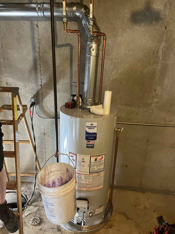Successfully completed a comprehensive HVAC and water heater installation in residential basement. Installed new Bradford White water heater with complete copper piping configuration, brass fittings, and pressure relief valve assembly connected to existing plumbing system. Added new air conditioning system with outdoor condensing unit, properly charged with refrigerant to manufacturer specifications (factory charge 52 oz, field charge 40 oz, total system charge 42 oz), including copper refrigerant line set with brass service valves and heat exchanger coil installation. Installed new furnace unit integrated with AC system for complete climate control solution. All equipment mounted, leveled, and secured per code requirements. Verified proper refrigerant charging, tested all electrical connections, and confirmed operational functionality of heating, cooling, and hot water systems.
