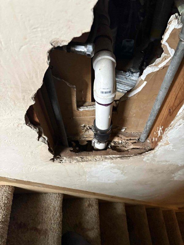 Completed comprehensive plumbing assessment for replacement of deteriorated cast iron piping system and investigation of suspected leak. Inspection revealed severely corroded cast iron pipes in crawl space with extensive rust degradation, pitting, and structural compromise at threaded connections, along with exposed PVC plumbing lines accessed through ceiling opening above stairwell. Documented existing conditions including corroded pipe sections, compromised fittings, and access points required for full system evaluation and provided detailed project estimate for complete pipe replacement.