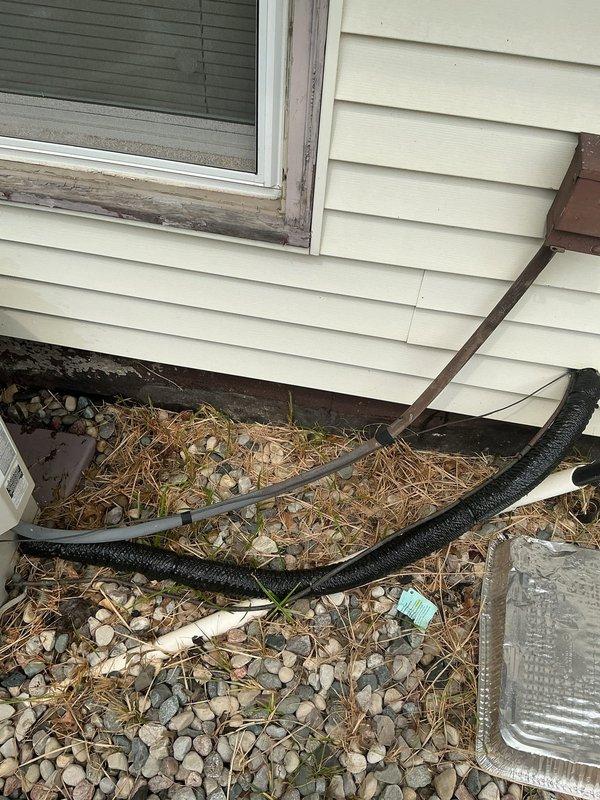 Completed annual cooling maintenance on 11-year-old Payne air conditioning system. Performed comprehensive tune-up including inspection of outdoor unit, replaced deteriorated pipe insulation on refrigerant lines, and verified proper drainage system operation around foundation perimeter. System tested and operating within normal parameters upon completion.