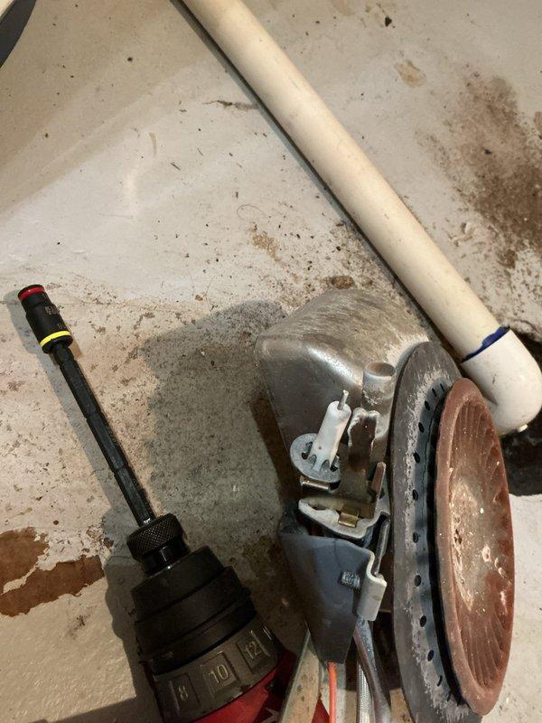 Responded to a no-heat complaint on a 10-year-old water heater. Upon inspection, found severely corroded heating element with heavy mineral buildup and rust accumulation preventing proper operation. Removed failed element, cleaned sediment from tank opening, and installed replacement heating element. Tested unit operation and verified proper heating function restored. Discussed membership benefits with customer during service call.