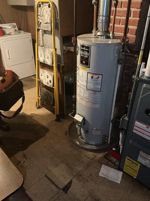 Responded to service call for 15-year-old water heater with no hot water production following AC tune-up. Upon inspection, identified issue with water heater operation and restored hot water service to the residence. Unit assessed and returned to normal working condition.