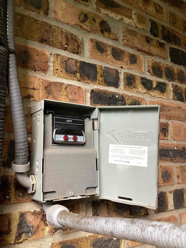 Responded to a no cooling call and performed system diagnostics on the outdoor HVAC unit. Upon arrival, found the electrical disconnect switch in the OFF position at the exterior-mounted disconnect box. Restored power to the unit by switching the disconnect to the ON position. Verified proper system operation with condenser unit running and cooling cycle initiated. Inspected outdoor unit installation on wooden deck platform, noting adequate clearance and airflow access through side grilles. System restored to normal cooling operation.