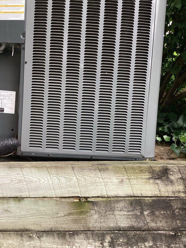 Responded to a no cooling call and performed system diagnostics on the outdoor HVAC unit. Upon arrival, found the electrical disconnect switch in the OFF position at the exterior-mounted disconnect box. Restored power to the unit by switching the disconnect to the ON position. Verified proper system operation with condenser unit running and cooling cycle initiated. Inspected outdoor unit installation on wooden deck platform, noting adequate clearance and airflow access through side grilles. System restored to normal cooling operation.