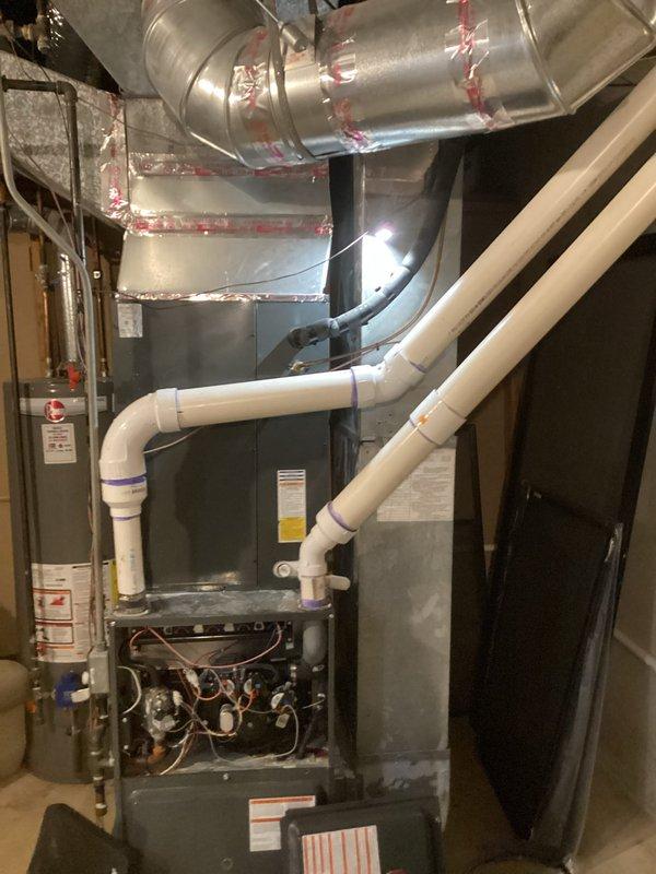 Conducted comprehensive inspection of residential HVAC system in basement utility area per homeowner request for repair and replacement options. Evaluated furnace unit, ductwork system including metal supply ducts with reflective insulation and flexible branch connections, condensate drainage lines, and overall system integration with existing plumbing infrastructure. Documented equipment conditions, mechanical components, and installation quality through photographic evidence for client review and recommendation development.